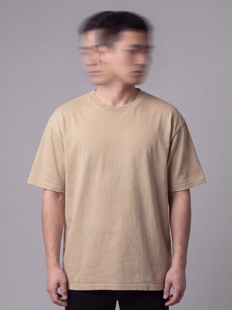 Model wearing the manila user : null artefact tee, front view, deliberately blank with no print, head blurred by long exposure